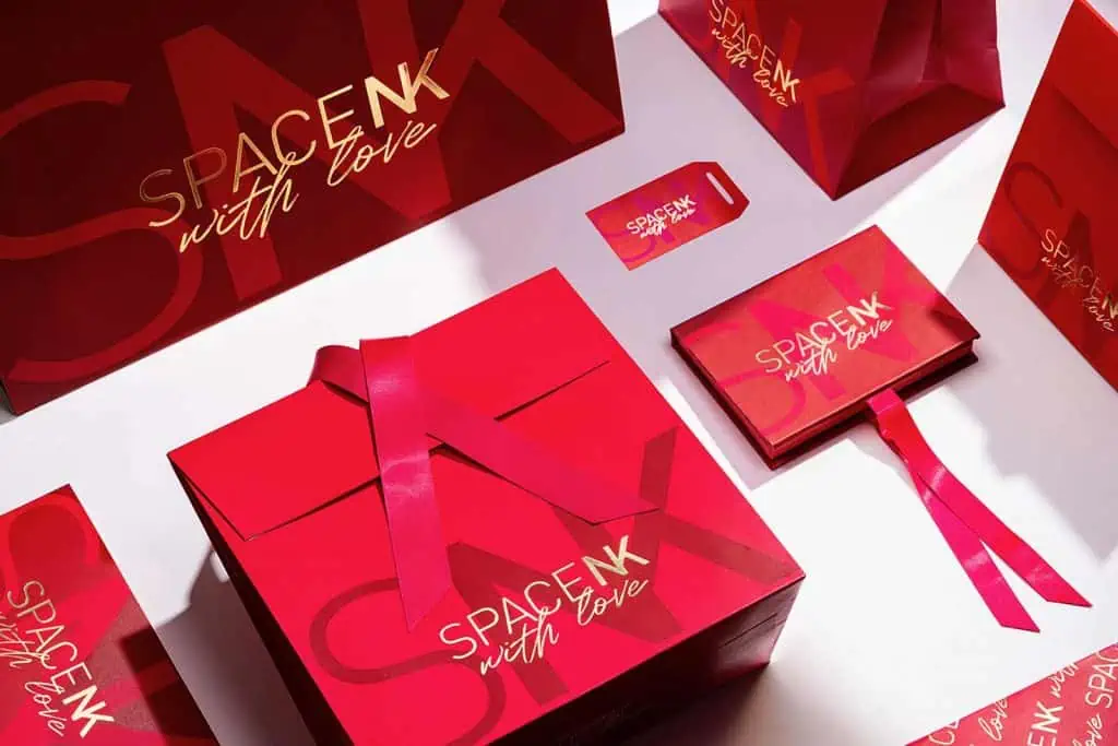 sustainable cosmetics packaging Space-NK-Holiday-Packaging-Design red custom boxes