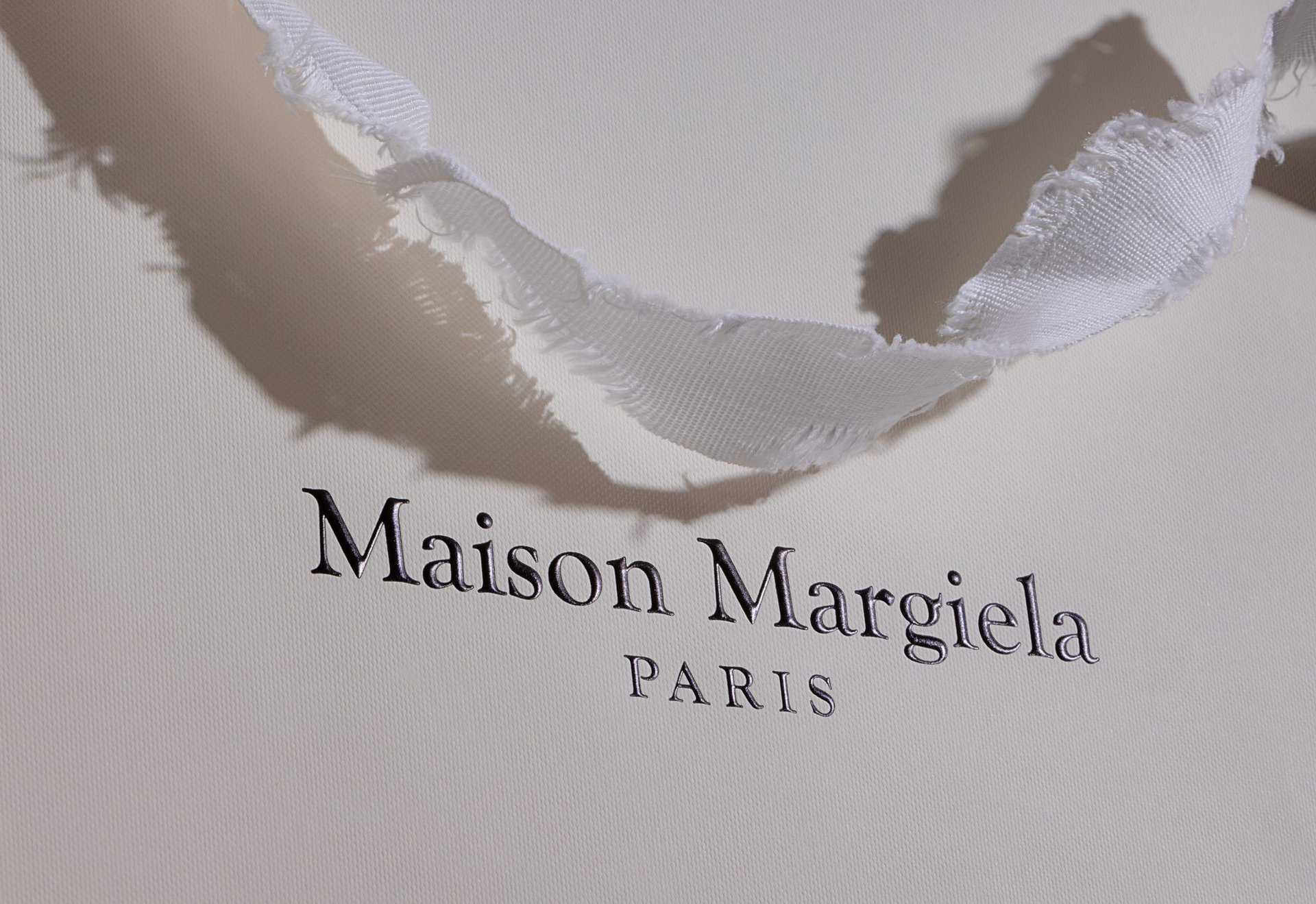 Luxury retail packaging Maison Margiela torn handles Recyclable Packaging Idpdirect.com sustainable Manufacturing